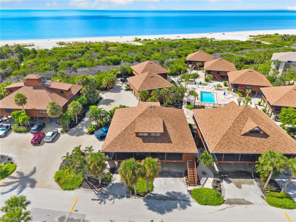 Drone / aerial view of unending shoreline and a pool