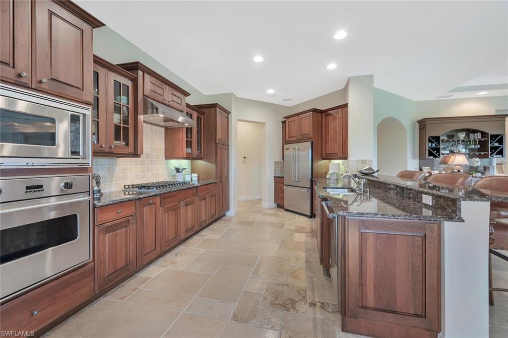 Gas cooktop & commercial hood.