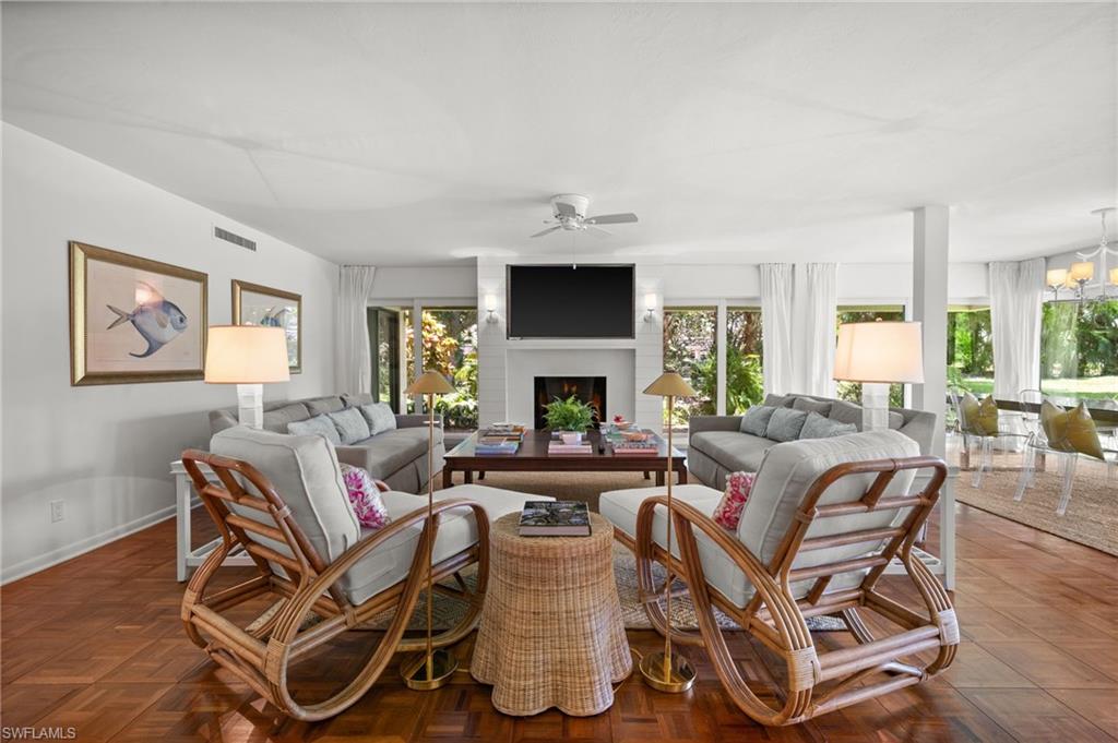 Gorgeous open-living concept with hurricane shutters and a working fireplace!
