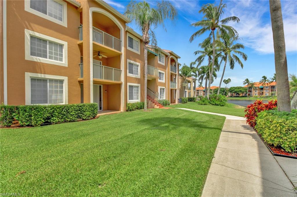 View of apartment building / complex with a water view