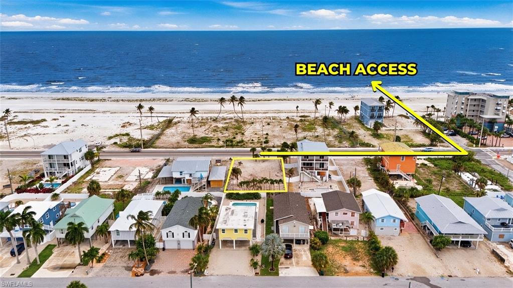 VIRTUALLY ENHANCED - Aerial view of a coastal property, highlighting proximity to a sandy beach