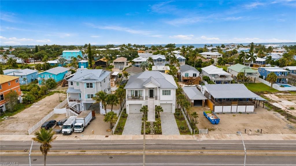 AI RENDERING, one level above garage with a front porch for sunset views on this 69 feet wide lot!