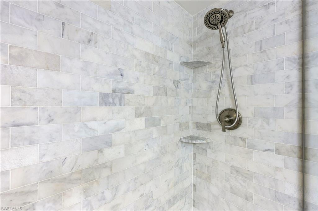 Bathroom view of a tile shower