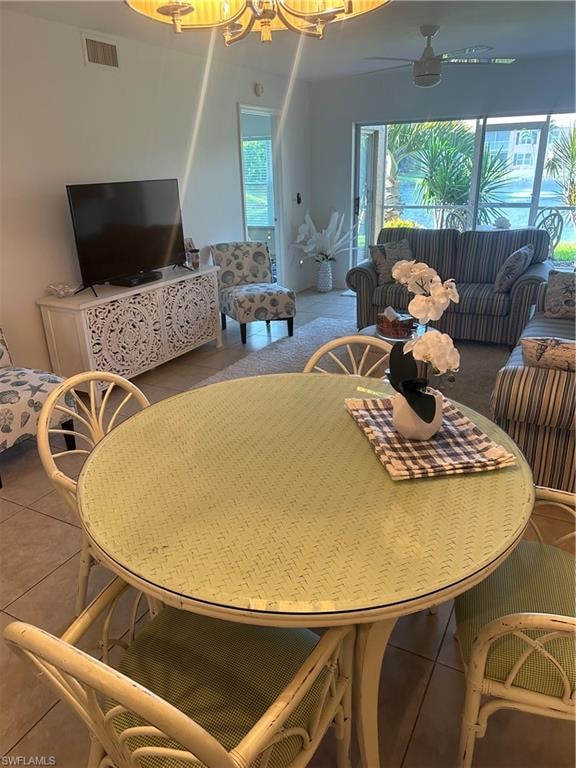 Tiled living room featuring ceiling fan