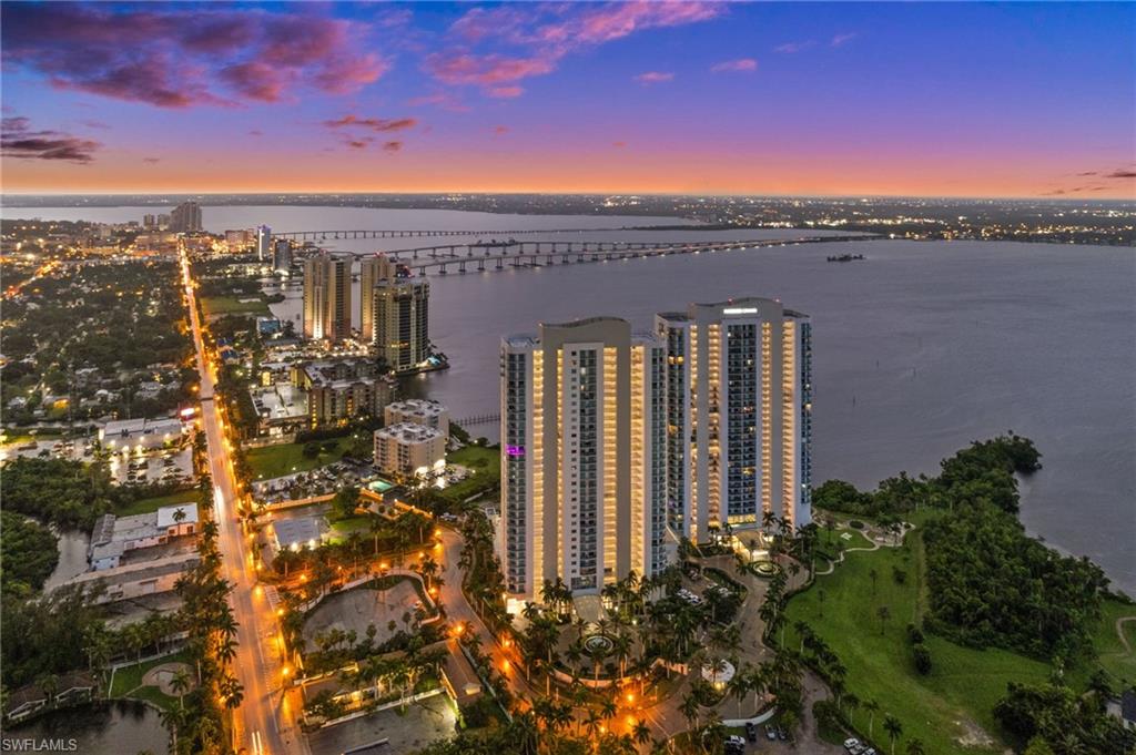 Aerial view of property and surrounding area with a large body of water