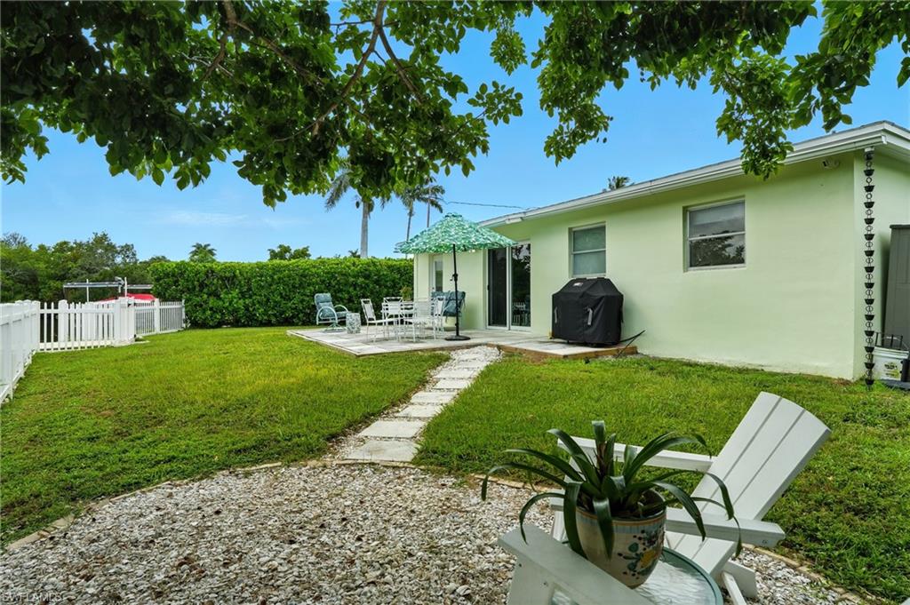 Fenced backyard with a patio area