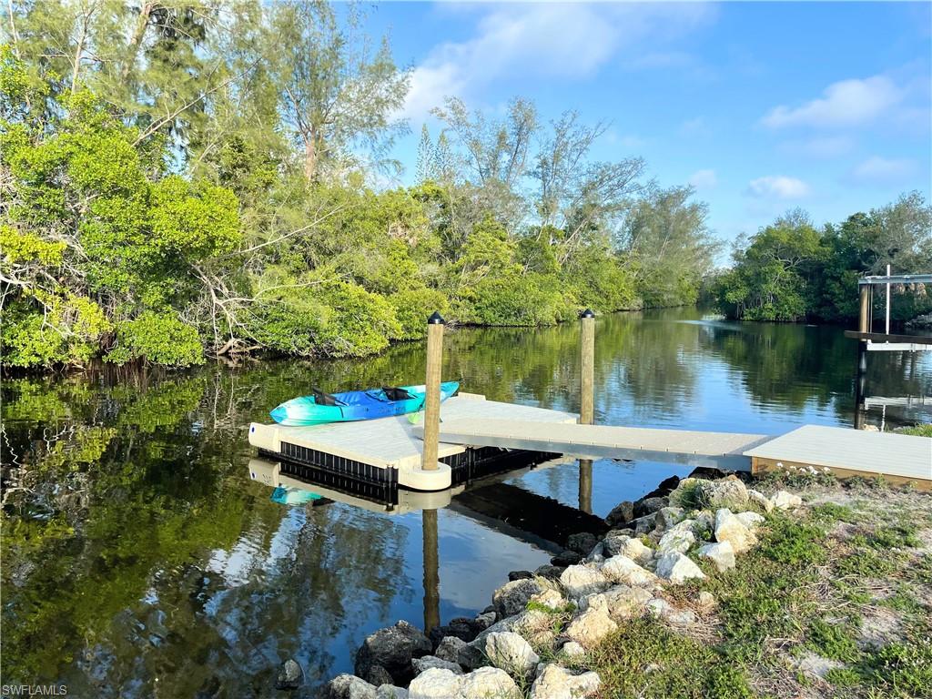 Dock area featuring a water view