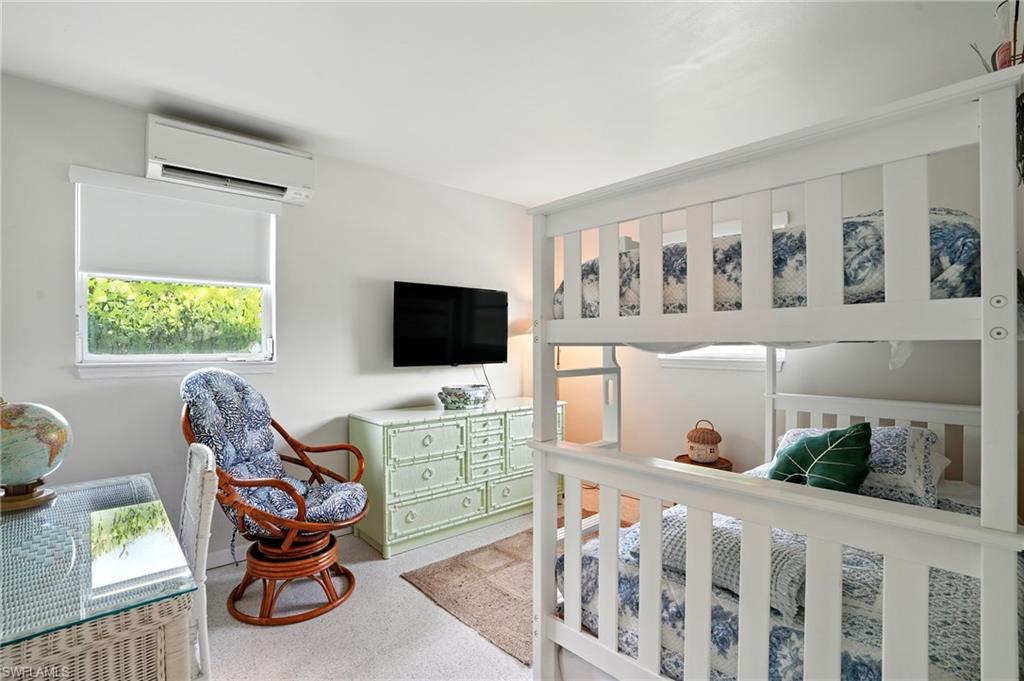 Bedroom with an AC wall unit