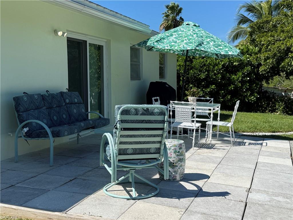 View of patio featuring an outdoor hangout area and outdoor dining area