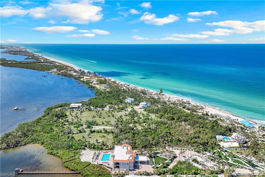 Aerial view of property and surrounding area featuring Lemon Bay on the left and the Gulf on the right