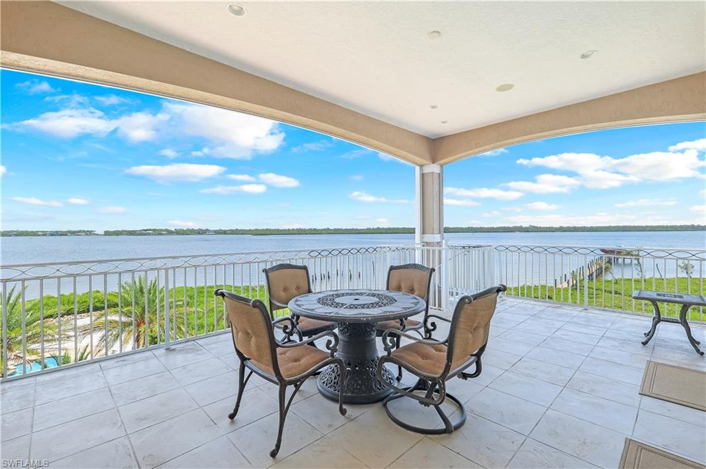 View of primary suite patio with a water view