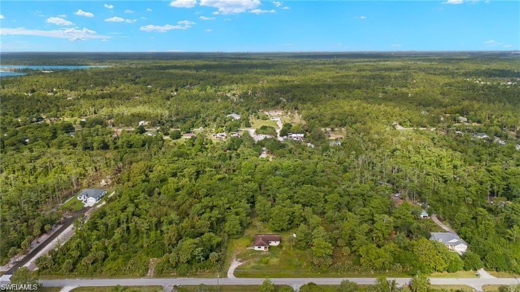View of property location with a forest