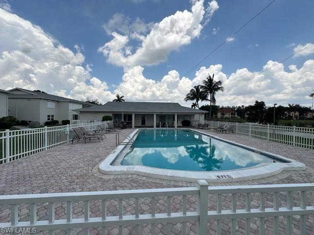 Community pool with a patio area
