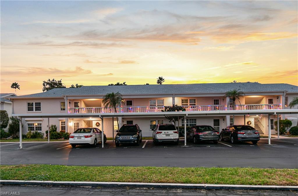 Property at dusk with covered parking
