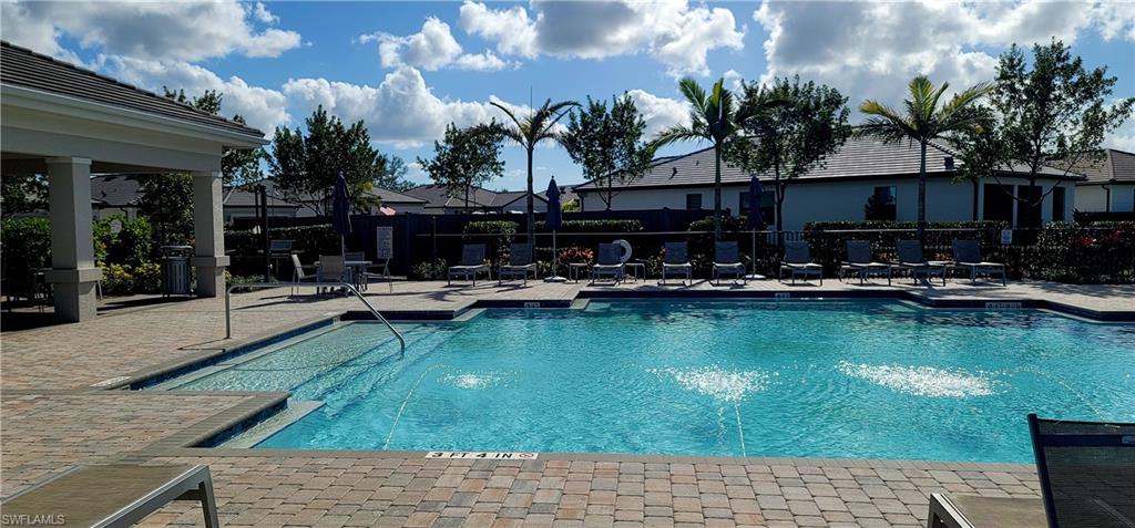View of community pool featuring a patio area