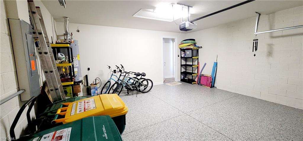 Garage with a garage door opener and water heater