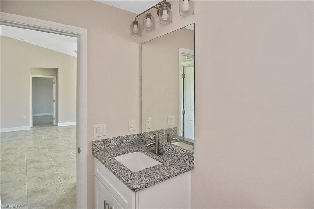 Bathroom featuring vanity and light tile patterned floors
