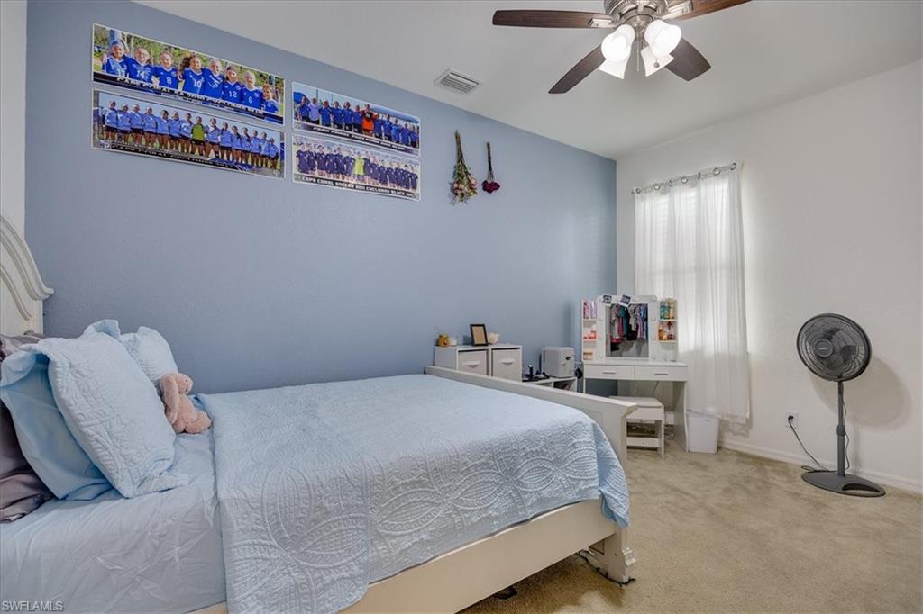 Bedroom featuring carpet and a ceiling fan