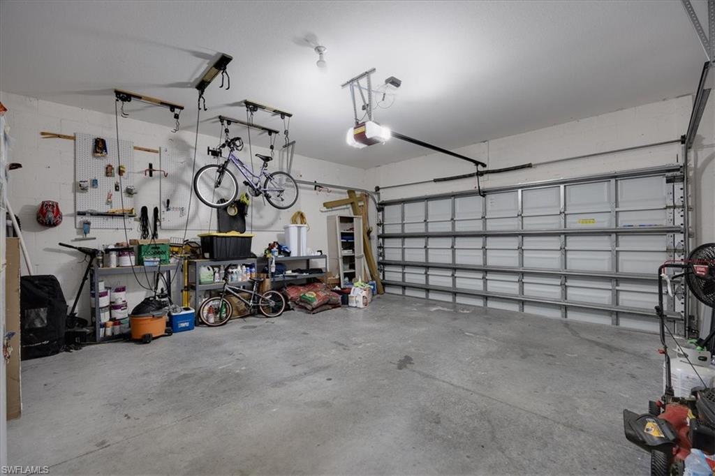 Garage featuring a garage door opener