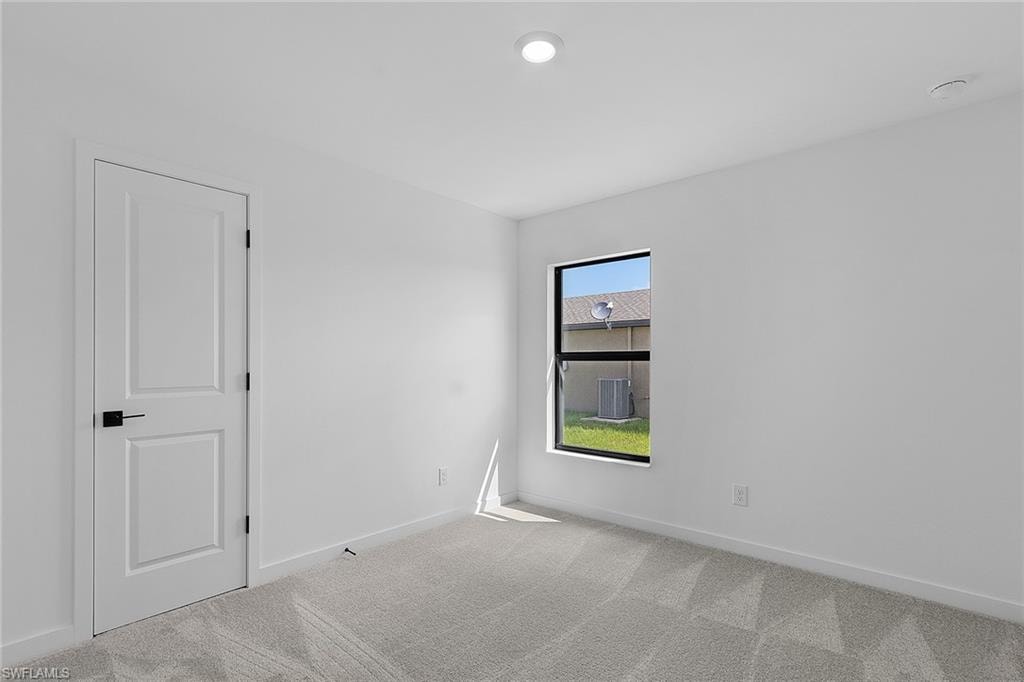 Empty room featuring carpet floors