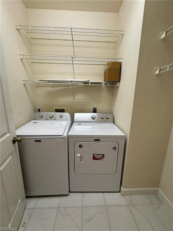 Laundry area featuring separate washer and dryer