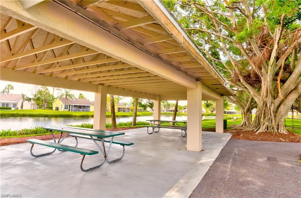 View of home's community with a patio and a water view