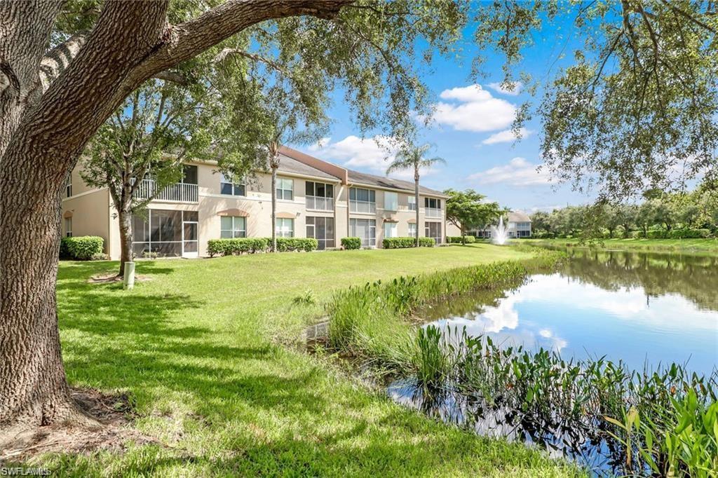 View of home's community featuring a lawn and a water view