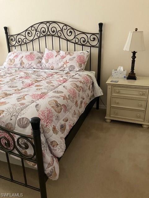 Bedroom with light carpet