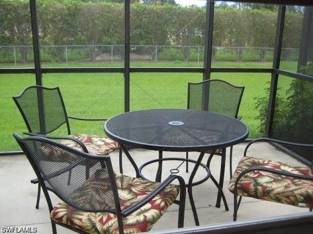 Sunroom with outdoor dining area