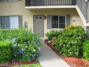 Doorway to property with stucco siding