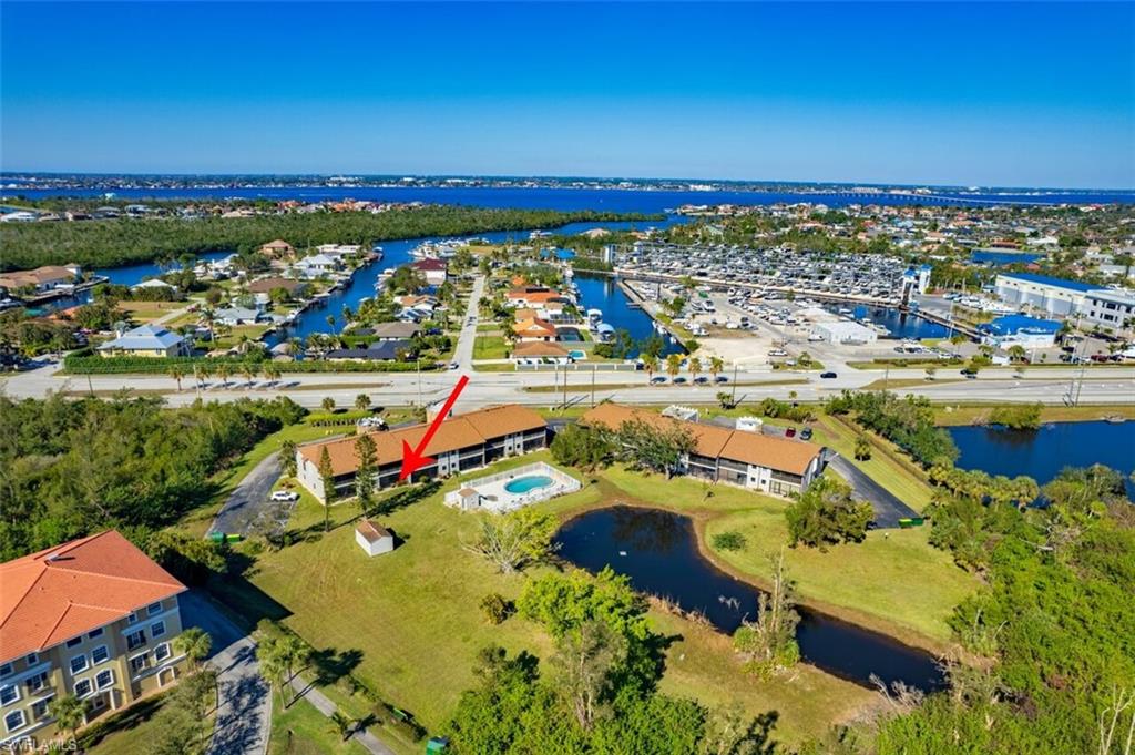Aerial view of property's location featuring a large body of water