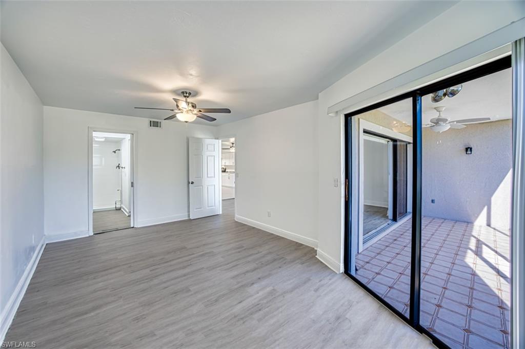 Spare room with ceiling fan and light wood finished floors
