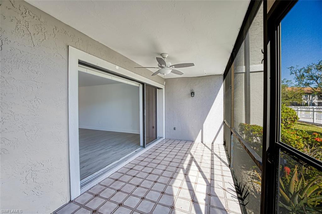 Unfurnished sunroom with a ceiling fan