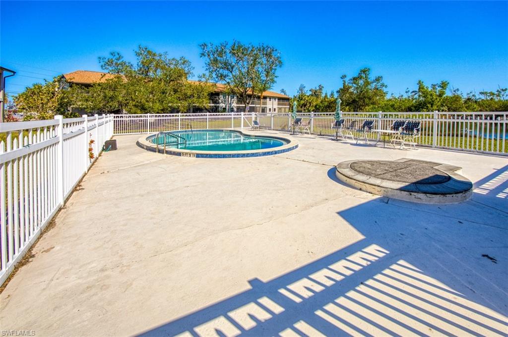 Community pool with a patio area