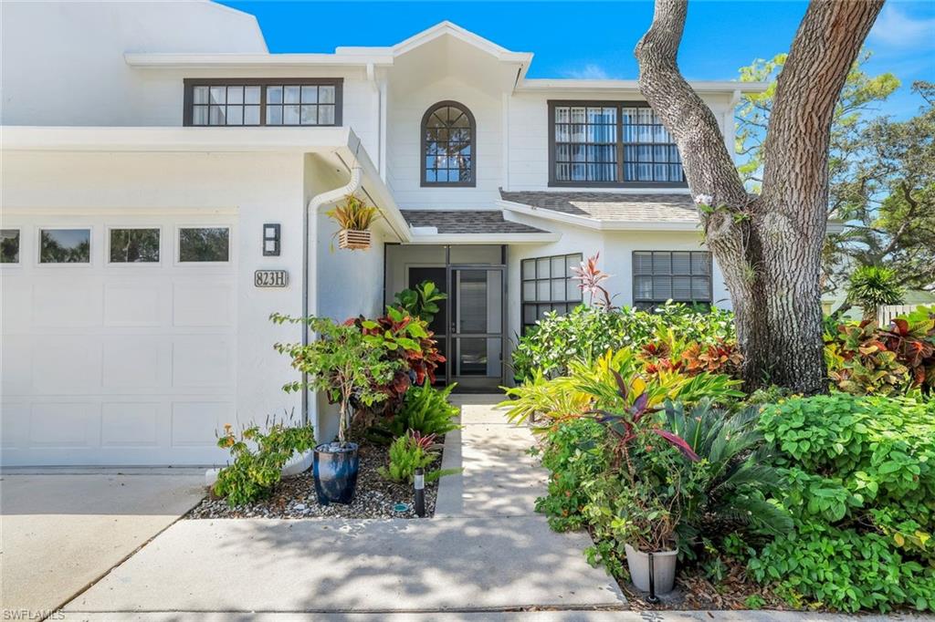 Doorway to property featuring a garage