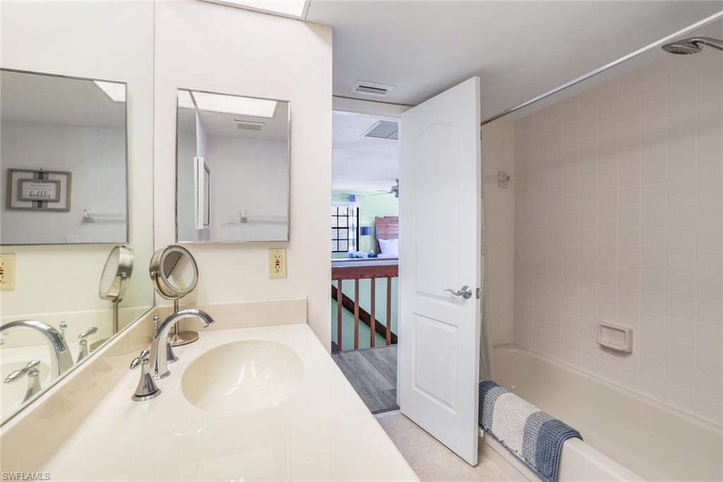 Full bath with shower / tub combo and vanity