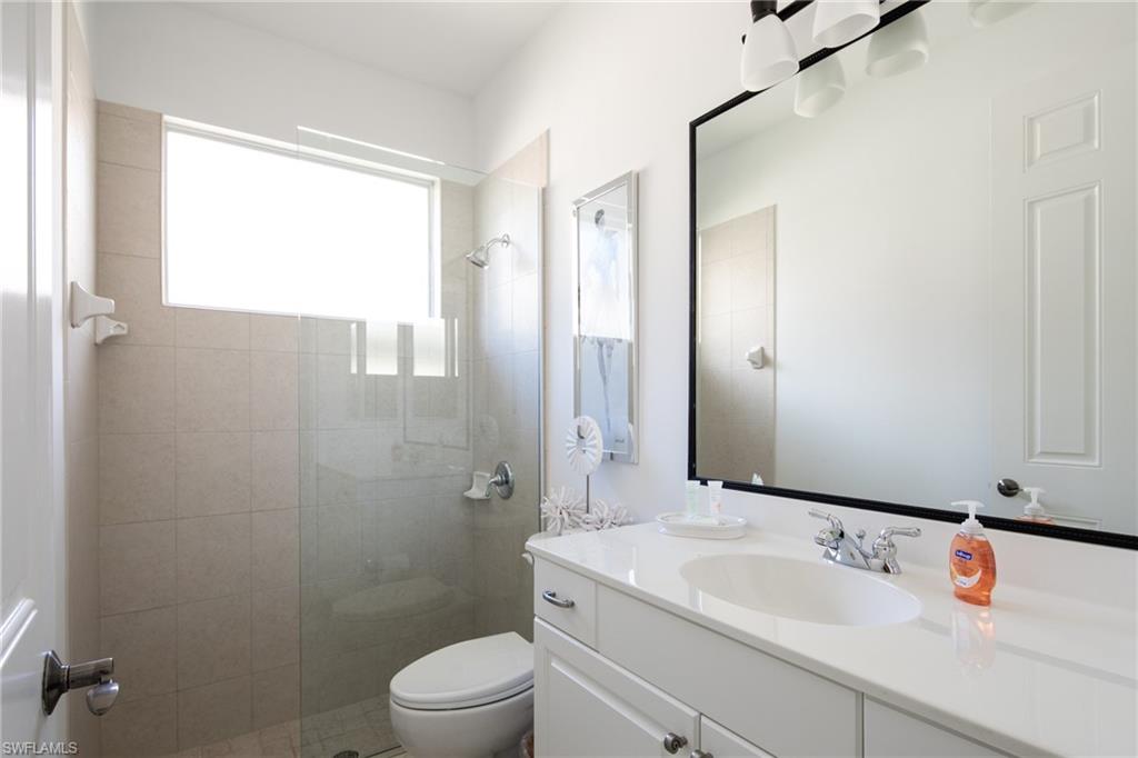 Full bathroom with vanity and walk in shower