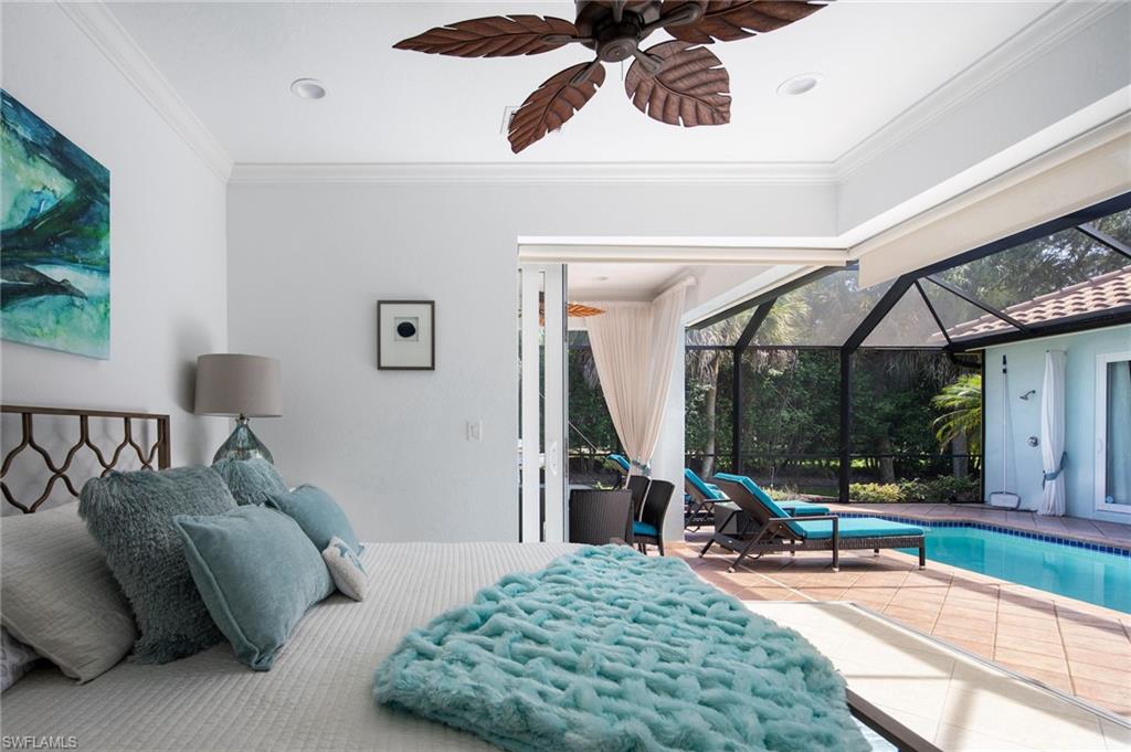 Bedroom with a sunroom, access to outside, tile patterned floors, crown molding, and a ceiling fan