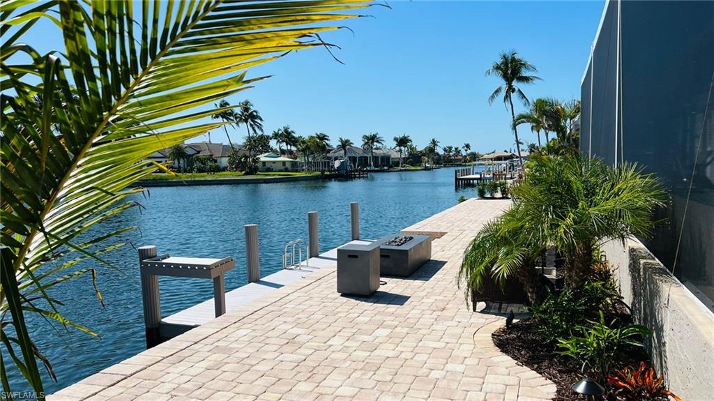 Dock featuring a water view and a residential view