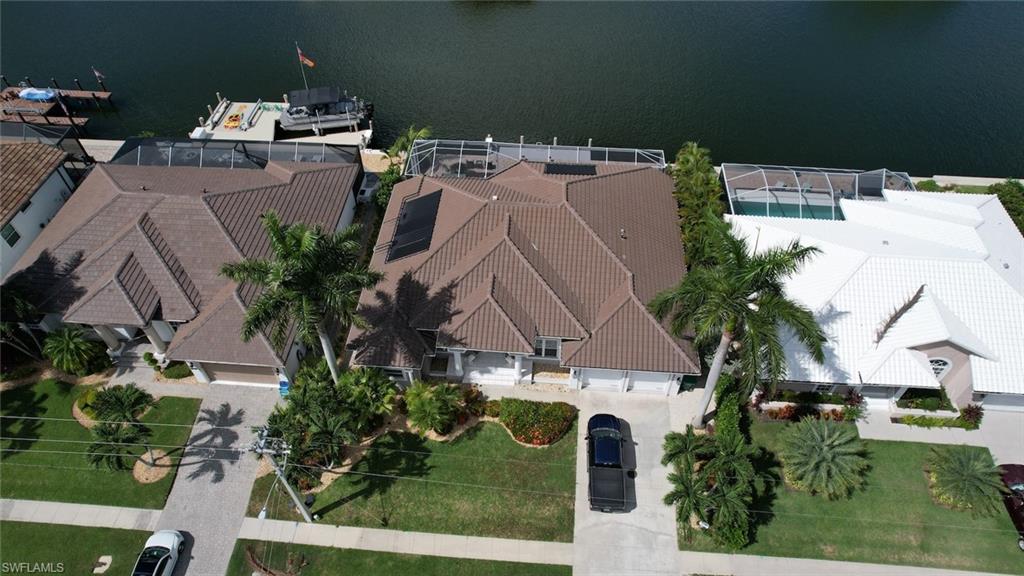 View from above of property with a nearby body of water