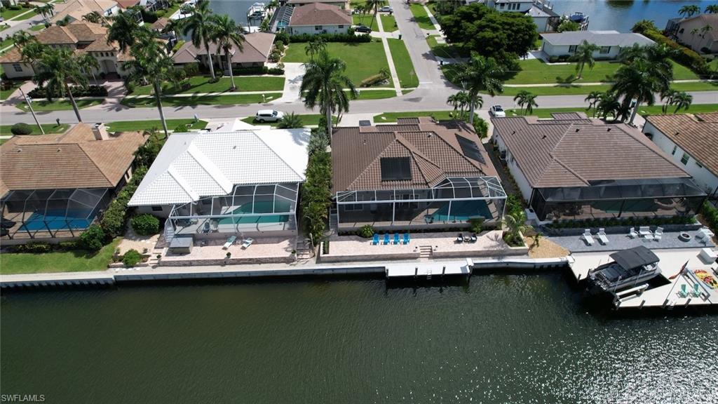 Aerial perspective of suburban area with a nearby body of water