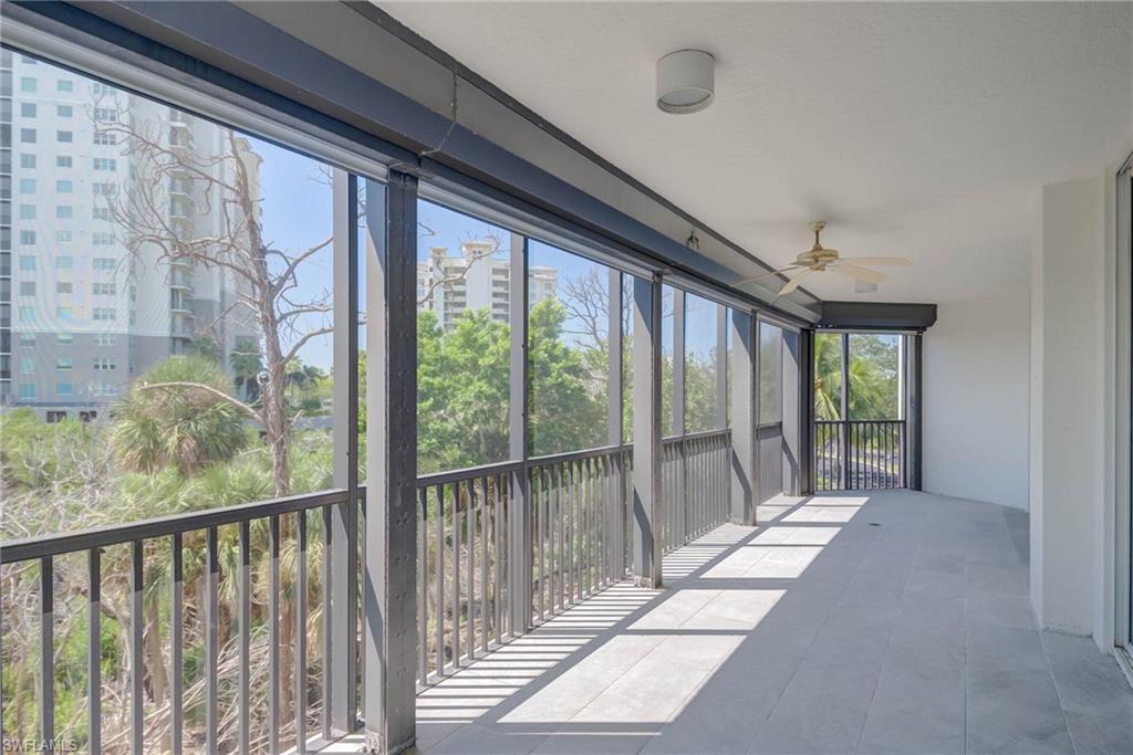 New Tiled  Balcony sunroom w/ceiling fan and a balcony and Screen at the End