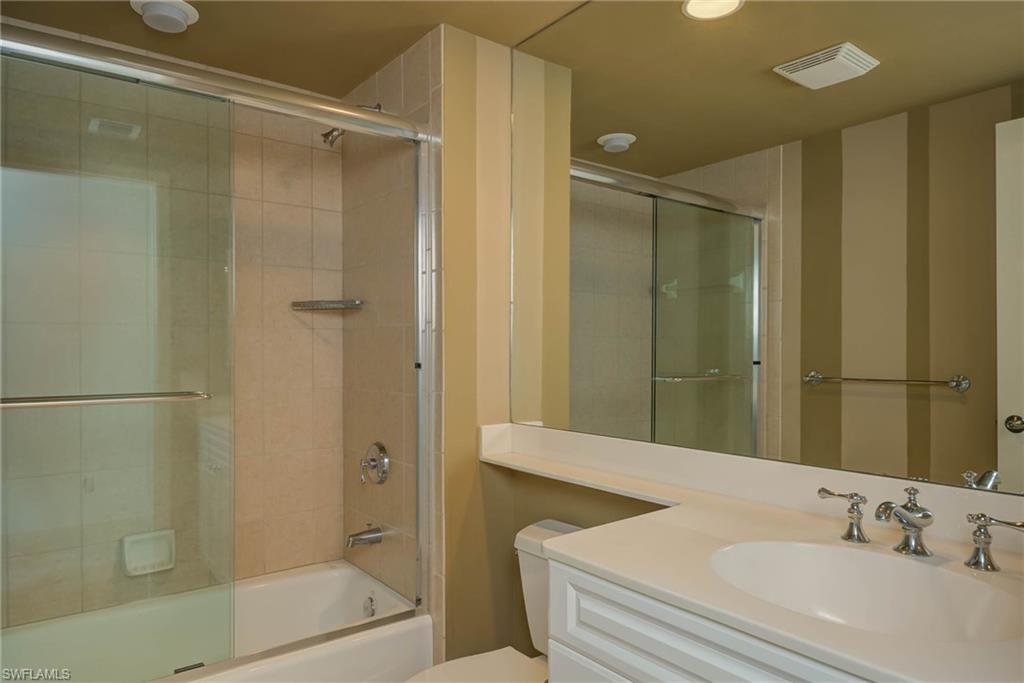 Full bathroom featuring shower / bath combination with glass door and vanity inside Bedroom 3