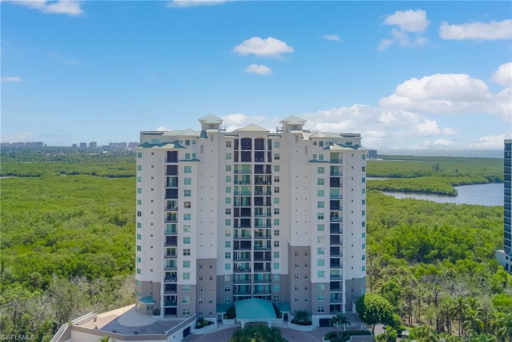 View of apartment building / complex with a water view