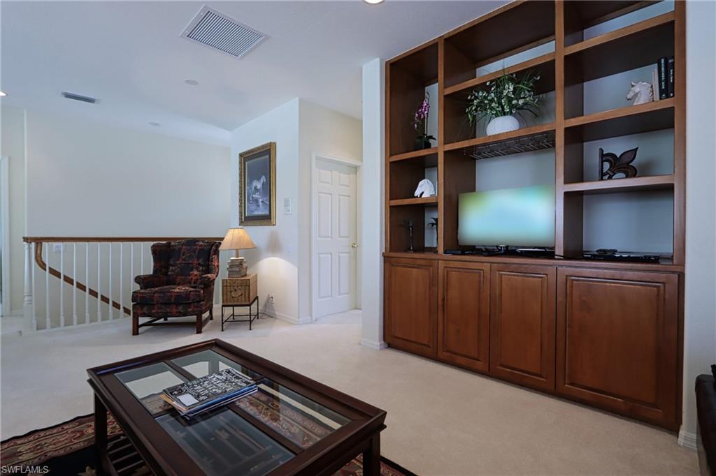Living room with light carpet