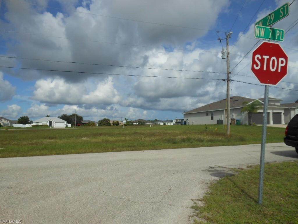 View of asphalt road with traffic signs