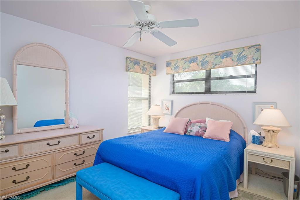 Bedroom featuring a ceiling fan and light carpet