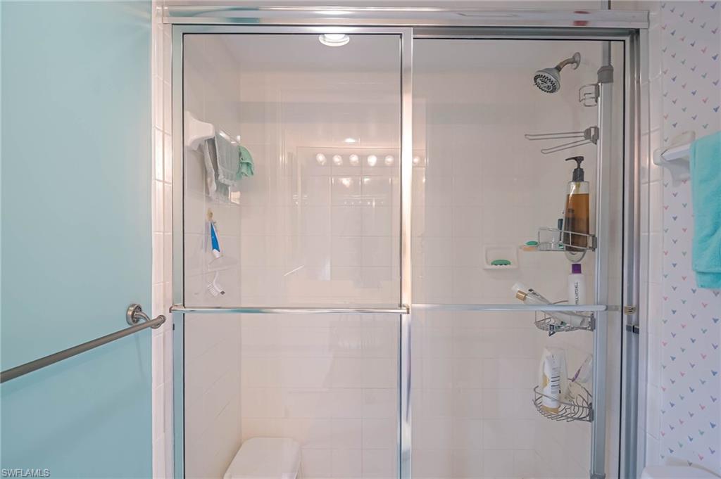 Full bathroom with a shower stall