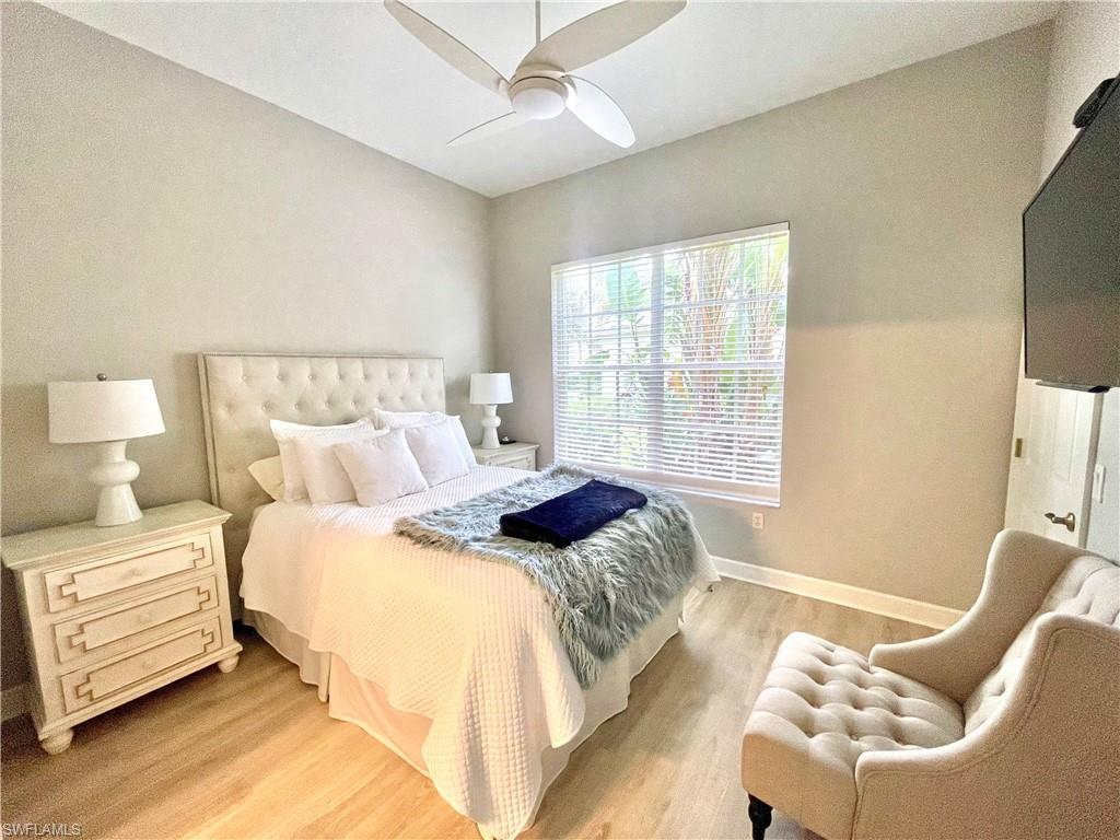 Bedroom featuring light wood-style floors and a ceiling fan