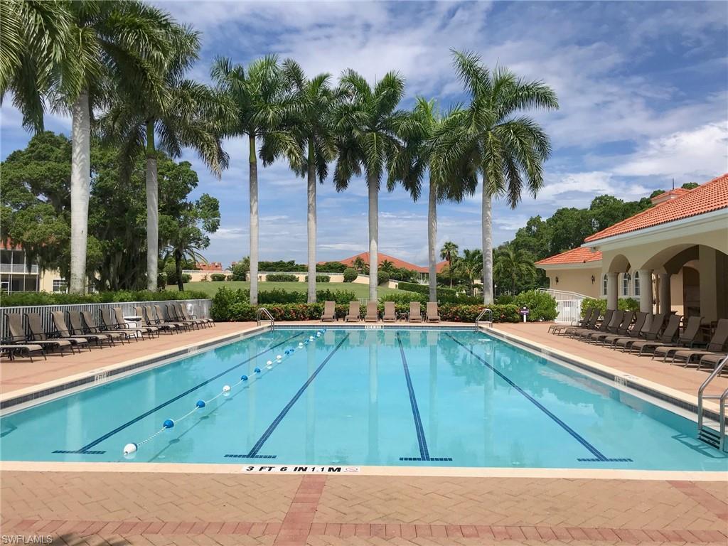 Community pool with a patio